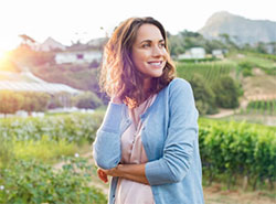 Woman smiling outside.